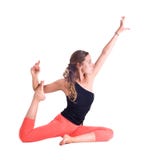 Los ejercicios practicantes de la yoga/la paloma real presentan - Eka Pada Rajakapotasana foto de archivo Los ejercicios practicantes de la yoga/la paloma real presentan - Eka Pada Rajakapotasana foto de archivo