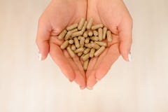 Capsules with medicine in the hands of a girl royalty free stock photos Capsules with medicine in the hands of a girl royalty free stock photos