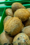 A lot coconuts in the supermarket. Many coco lying in a boxes royalty free stock photos A lot coconuts in the supermarket. Many coco lying in a boxes royalty free stock photos