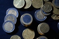 A lot of euro coins and cents on black stock photography A lot of euro coins and cents on black stock photography