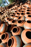 Round clay pots drying