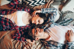 Love couple in clothes embrace on couch, top view Stock Images Love couple in clothes embrace on couch, top view Stock Images