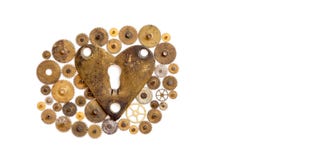Love heart steampunk machinery ornament on white. Aged bronze keyhole heart shape with many textured cogs gears wheels stock photography Love heart steampunk machinery ornament on white. Aged bronze keyhole heart shape with many textured cogs gears wheels stock photography