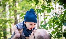 Love moments between father and son in forest park Royalty Free Stock Photo Love moments between father and son in forest park Royalty Free Stock Photo