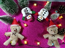 Lovely couple bear and snowman on pink gliter background near ornament lighting bulb at silent night, holy night, Merry Chr royalty free stock photo Lovely couple bear and snowman on pink gliter background near ornament lighting bulb at silent night, holy night, Merry Chr royalty free stock photo