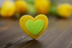 Lovely pink yellow heart with romantic colorful tulips spring flowers decoration. stock photography Lovely pink yellow heart with romantic colorful tulips spring flowers decoration. stock photography
