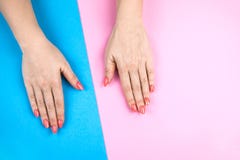Lovely young woman`s hands on colored background. royalty free stock image Lovely young woman`s hands on colored background. royalty free stock image