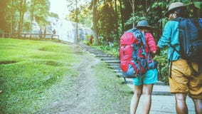 Lover Women And Men Asian Travel Nature. Travel Relax. Natural Touch Countryside. On The Moutain. At Waterfall Use Summer. Stock Images Lover Women And Men Asian Travel Nature. Travel Relax. Natural Touch Countryside. On The Moutain. At Waterfall Use Summer. Stock Images