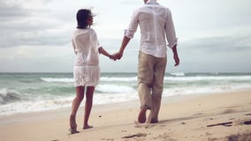 Loving couple on beach in slow motion