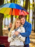 Loving couple on a date under umbrella stock photo Loving couple on a date under umbrella stock photo