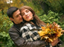 Loving Couple In Autumnal Park Stock Photos