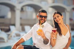Loving couple spending vacation on tropical resort swimming pool.Newlyweds honeymoon on seaside royalty free stock photos Loving couple spending vacation on tropical resort swimming pool.Newlyweds honeymoon on seaside royalty free stock photos