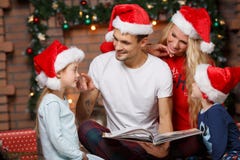 Loving family in Santa hats stock image Loving family in Santa hats stock image