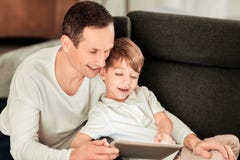 Delighted nice man hugging his son royalty free stock photography Delighted nice man hugging his son royalty free stock photography