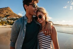 Loving young couple walking on beach royalty free stock photos Loving young couple walking on beach royalty free stock photos
