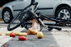 Low angle on groceries and bike after car accident with drunk dr stock images Low angle on groceries and bike after car accident with drunk dr stock images