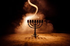 Low Key Image Of Jewish Holiday Hanukkah Background With Menorah On Dark Toned Foggy Background Stock Image
