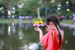 Loy Krathong festival, Asian Child girl in Thai traditional dress with holding krathong for forgiveness Goddess Ganges to celebrat royalty free stock photography Loy Krathong festival, Asian Child girl in Thai traditional dress with holding krathong for forgiveness Goddess Ganges to celebrat royalty free stock photography