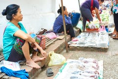LUANG PRABANG, LAOS - APRIL 17. 2019 : Local selling food at the morning market in Luang Prabang, Laos stock photos LUANG PRABANG, LAOS - APRIL 17. 2019 : Local selling food at the morning market in Luang Prabang, Laos stock photos