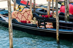 The luxurious decoration of the Venetian gondola, which is moored at the pier. royalty free stock image The luxurious decoration of the Venetian gondola, which is moored at the pier. royalty free stock image