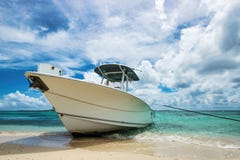 Luxury Boat Anchored On A Caribbean Beach Royalty Free Stock Photography