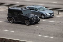 Luxury car black Mercedes Benz G speeding on empty highway Royalty Free Stock Image Luxury car black Mercedes Benz G speeding on empty highway Royalty Free Stock Image