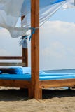 Luxury and romantic bed on the seashore for relaxing time stock images Luxury and romantic bed on the seashore for relaxing time stock images