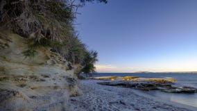 Luz de la puesta del sol en la playa en Jervis Bay National Park, NSW, Australia de Murrays fotos de archivo Luz de la puesta del sol en la playa en Jervis Bay National Park, NSW, Australia de Murrays fotos de archivo