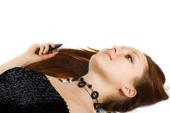 Lying Woman With Long Hairs And Comb Stock Image