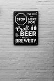 Lyme Regis, Dorset, England, February, 24, 2019: The sign for the Lyme Regis Brewery, against a white washed brick wall royalty free stock images Lyme Regis, Dorset, England, February, 24, 2019: The sign for the Lyme Regis Brewery, against a white washed brick wall royalty free stock images