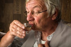 Läppja ett skottexponeringsglas Arkivbild Läppja ett skottexponeringsglas Arkivbild