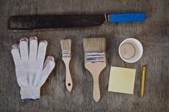Machete. gloves and two brushes to paint, to write notes with a simple pencil and a blank for the cup of coffee. Stock Image Machete. gloves and two brushes to paint, to write notes with a simple pencil and a blank for the cup of coffee. Stock Image