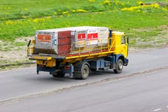 Machine carries luggage containers of Emirates Airline Company in Pulkovo International airport in Saint-Petersburg, Russia royalty free stock photo Machine carries luggage containers of Emirates Airline Company in Pulkovo International airport in Saint-Petersburg, Russia royalty free stock photo