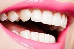 Macro happy female smile with healthy white teeth