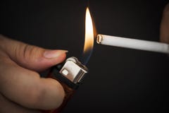 Macro shot of hand holding lighter Royalty Free Stock Photos Macro shot of hand holding lighter Royalty Free Stock Photos