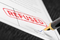 Macro shot of red stamp refused and fountain pen on a form. stock image Macro shot of red stamp refused and fountain pen on a form. stock image