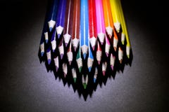 Macro Shot of Sharpened Colorful Pencils Against Black Background. Instruments for writing or drawing, consisting of a thin stick of graphite enclosed in a Stock Photography Macro Shot of Sharpened Colorful Pencils Against Black Background. Instruments for writing or drawing, consisting of a thin stick of graphite enclosed in a Stock Photography