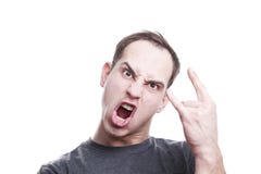 Mad the young man yells and shows rock and roll hand sign royalty free stock photo Mad the young man yells and shows rock and roll hand sign royalty free stock photo