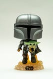 Closeup of funko pop from The Mandalorian with the child with rocking head from star wars