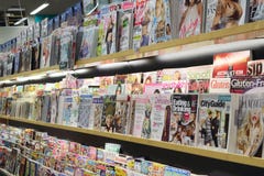 Magazine and cleaning product inside supermarket Royalty Free Stock Images Magazine and cleaning product inside supermarket Royalty Free Stock Images