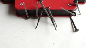 The magnet pulls metal nails