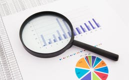 Magnifier on business background. stock image Magnifier on business background. stock image
