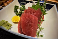 Maguro Sashimi with Sake at an Izakaya, Tokyo, Japan royalty free stock photo Maguro Sashimi with Sake at an Izakaya, Tokyo, Japan royalty free stock photo