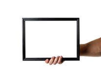 Main tenant le cadre A4 noir Un cadre vide avec un fond blanc Fin vers le haut D'isolement sur le fond blanc photos stock Main tenant le cadre A4 noir Un cadre vide avec un fond blanc Fin vers le haut D'isolement sur le fond blanc photos stock