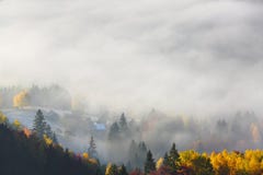 Majestic autumn rural scenery. Landscape with beautiful mountains, fields and forests covered with morning fog. Carpathian valley. stock photo Majestic autumn rural scenery. Landscape with beautiful mountains, fields and forests covered with morning fog. Carpathian valley. stock photo