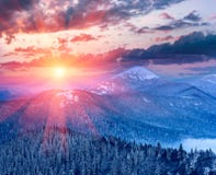 Majestic landscape in the winter mountains at sunrise. stock photo Majestic landscape in the winter mountains at sunrise. stock photo