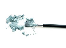 Make-up brush with colorful crushed eyeshadows. stock photo Make-up brush with colorful crushed eyeshadows. stock photo