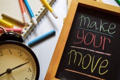 Make your move on phrase colorful handwritten on chalkboard, alarm clock with motivation and education concepts. royalty free stock photo Make your move on phrase colorful handwritten on chalkboard, alarm clock with motivation and education concepts. royalty free stock photo