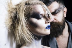 Makeup couple. Sensual woman and bearded man with makeup and stylish hair. We makeup your face. Makeup and beauty royalty free stock photography Makeup couple. Sensual woman and bearded man with makeup and stylish hair. We makeup your face. Makeup and beauty royalty free stock photography