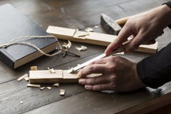 Making a homemade wooden cross on a table stock photos Making a homemade wooden cross on a table stock photos